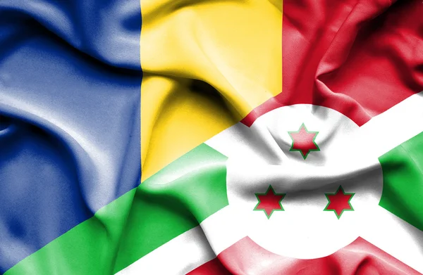 Vlající vlajka burundi a Rumunska — Stock fotografie