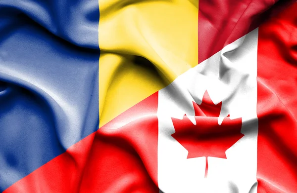 加拿大和罗马尼亚那飘扬的旗帜 — 图库照片