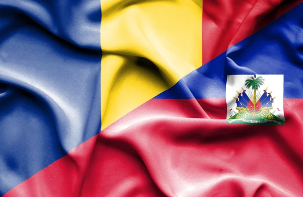 Waving flag of Haiti and Romania — Stock Photo, Image