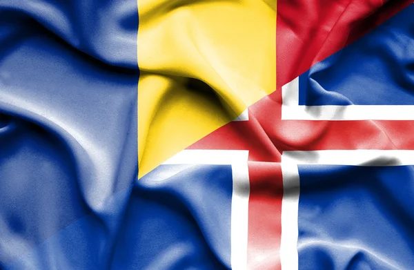 Bandera ondeante de Islandia y Rumanía —  Fotos de Stock