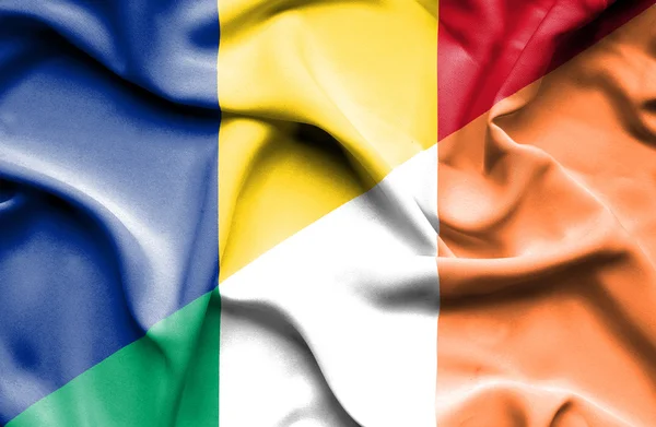 Waving flag of Ireland and Romania — Stock Photo, Image