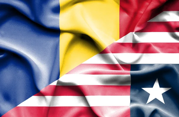 Waving flag of Liberia and Romania — Stock Photo, Image