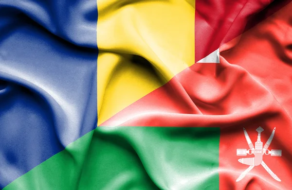 Umman ve Romanya bayrağı sallayarak