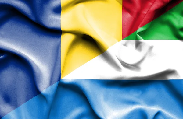 Waving flag of Sierra Leone and Romania — Stock Photo, Image