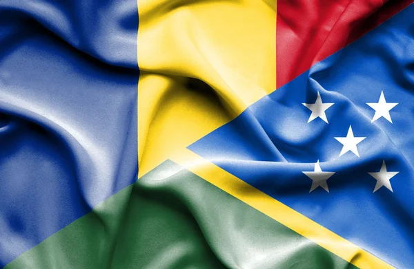 Waving flag of Solomon Islands and Romania — Stock Photo, Image