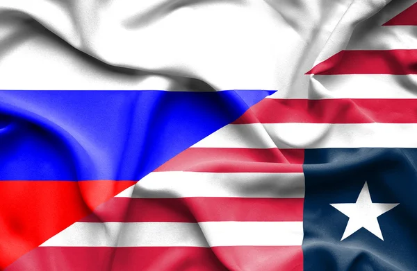 Waving flag of Liberia and Russia — Stock Photo, Image