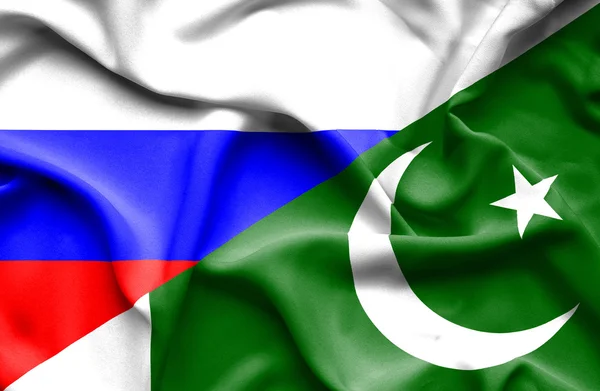 パキスタン、ロシアの旗を振っています。 — ストック写真