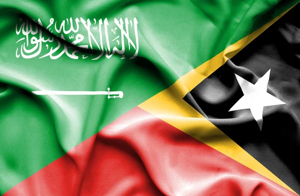 Doğu timor ve Suudi Arabistan bayrağı sallayarak — Stok fotoğraf