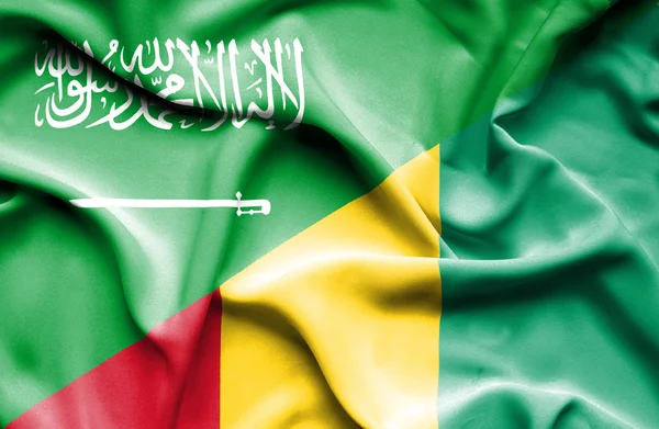Waving flag of Guinea and Saudi Arabia — Stock Photo, Image
