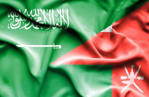 Umman ve Suudi Arabistan bayrağı sallayarak — Stok fotoğraf