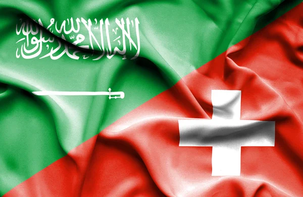 İsviçre ve Suudi Arabistan bayrağı sallayarak — Stok fotoğraf