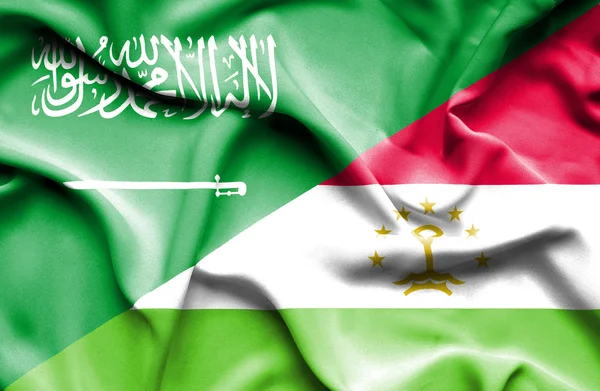 Vlající vlajka Tádžikistánu a Saúdská Arábie — Stock fotografie