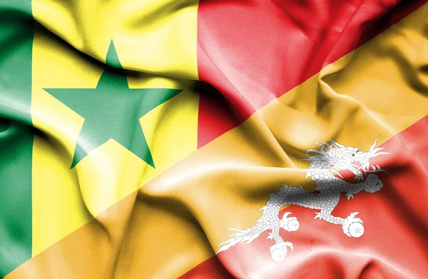 Waving flag of Bhutan and Senegal — Stock Photo, Image