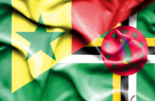 Macha flagą Dominika i Senegalu — Zdjęcie stockowe