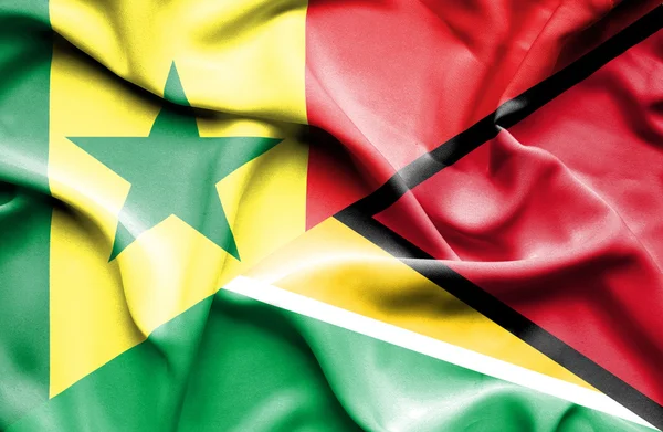 Waving flag of Guyana and Senegal — Stock Photo, Image