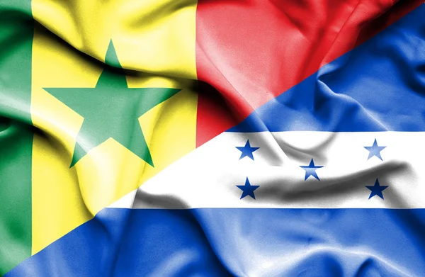 Waving flag of Honduras and Senegal — Stock Photo, Image