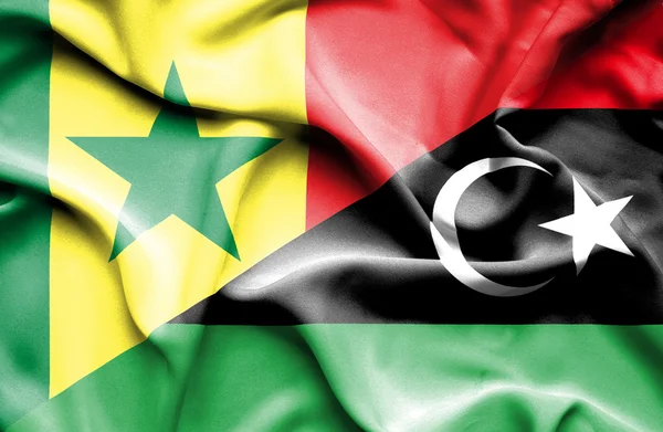 Wapperende vlag van Libië en senegal — Stockfoto