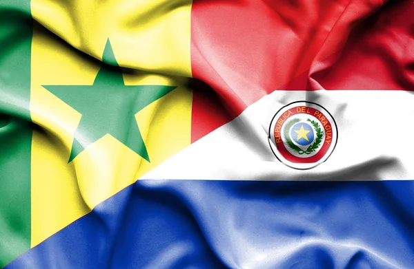 Waving flag of Paraguay and Senegal — Stock Photo, Image