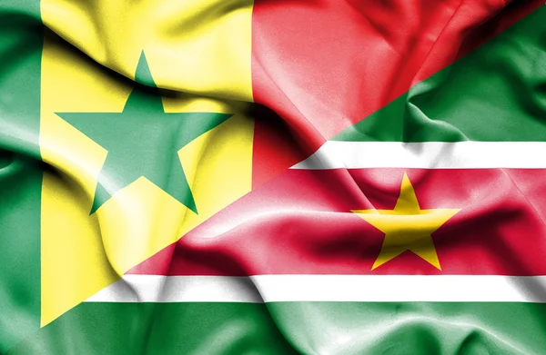 Bandeira ondulada do Suriname e Senegal — Fotografia de Stock