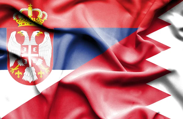 Waving flag of Bahrain and Serbia — Stock Photo, Image