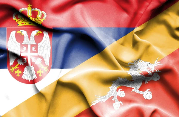 Розмахуючи прапором Бутан і Сербії — стокове фото