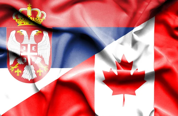 Ondeando la bandera de Canadá y Serbia — Foto de Stock