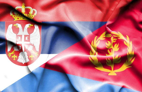 Waving flag of Eritrea and Serbia — Stock Photo, Image