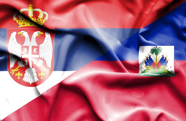 Vlající vlajka Srbska a haiti — Stock fotografie