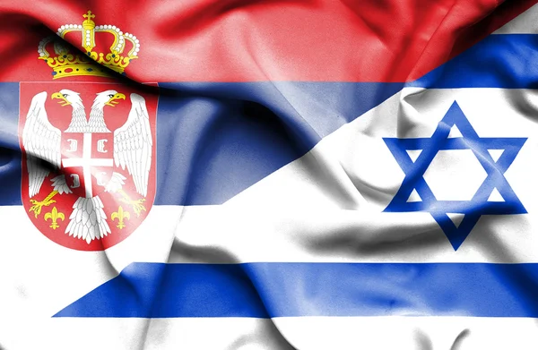 Waving flag of Israel and Serbia — Stock Photo, Image