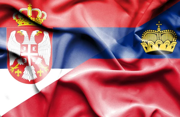 利希滕斯坦和塞尔维亚那飘扬的旗帜 — 图库照片