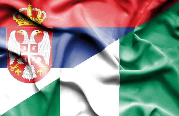 Waving flag of Nigeria and Serbia — Stock Photo, Image