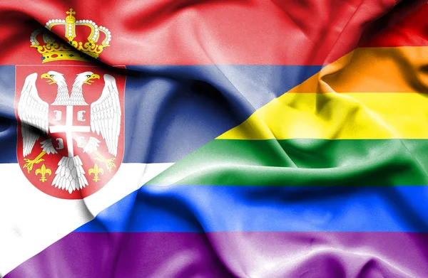Viftande flagga stolthet och Serbien — Stockfoto