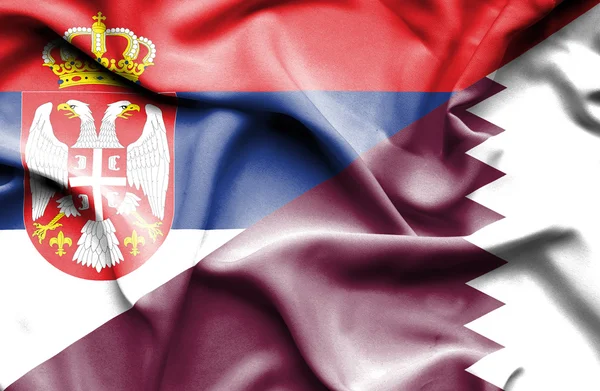 Waving flag of Qatar and Serbia — Stock Photo, Image