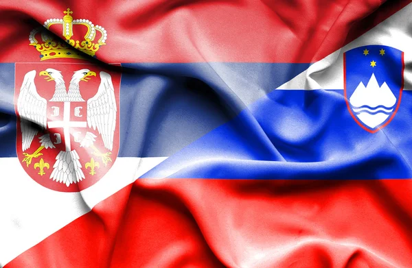 Waving flag of Slovenia and Serbia — Stock Photo, Image