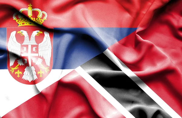 Sventolando bandiera di Trinidad e Tobago e Serbia — Foto Stock