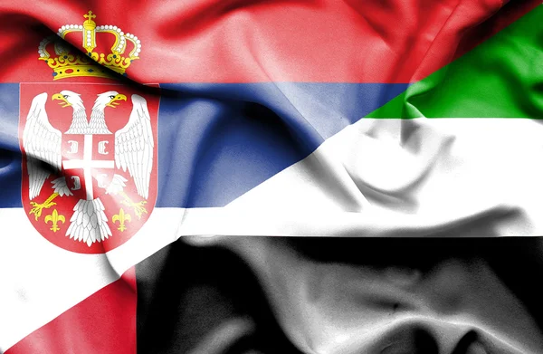 アラブ首長国連邦、セルビアの旗を振っています。 — ストック写真