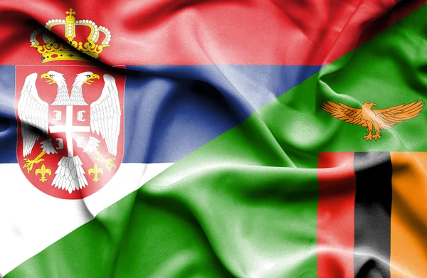 Bandeira ondulada do Zimbabué e da Sérvia — Fotografia de Stock