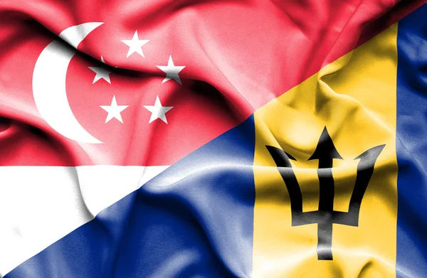Wapperende vlag van barbados en singapore — Stockfoto