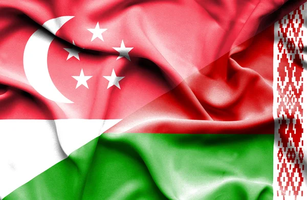Waving flag of Belarus and Singapore — Stock Photo, Image