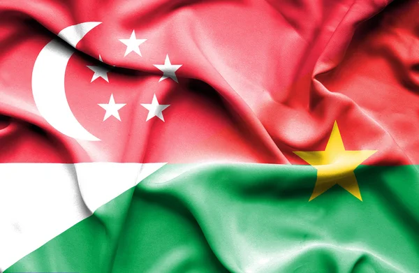 Bandera ondeante de Burkina Faso y Singapur —  Fotos de Stock