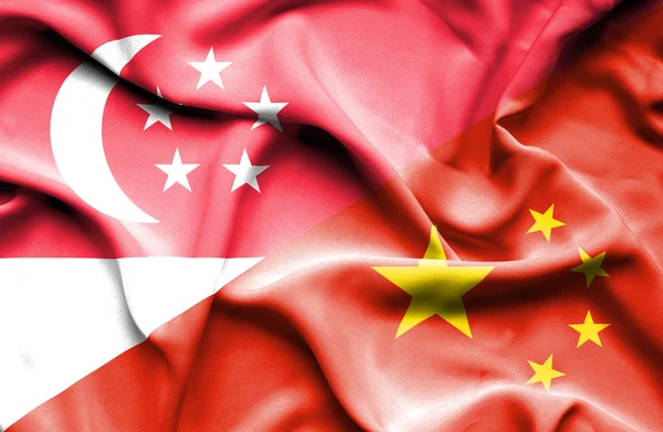 Waving flag of China and Singapore — Stock Photo, Image