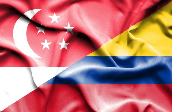 Waving flag of Columbia and Singapore — Stock Photo, Image