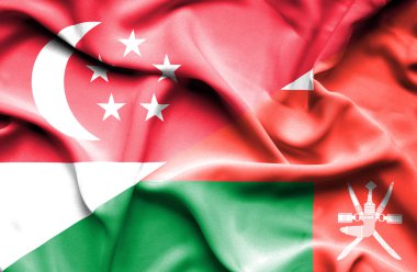 viftande flagga oman och singapore