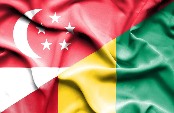 Bandera ondeante de Guinea y Singapur —  Fotos de Stock