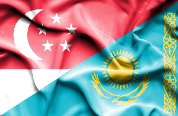 Bandeira ondulada do Cazaquistão e Singapura — Fotografia de Stock