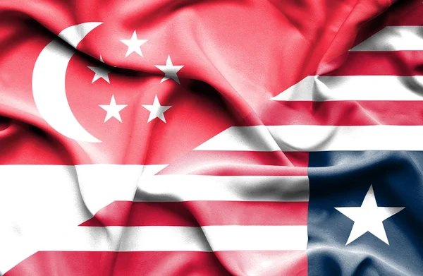 Machać flaga Liberii i Singapuru — Zdjęcie stockowe