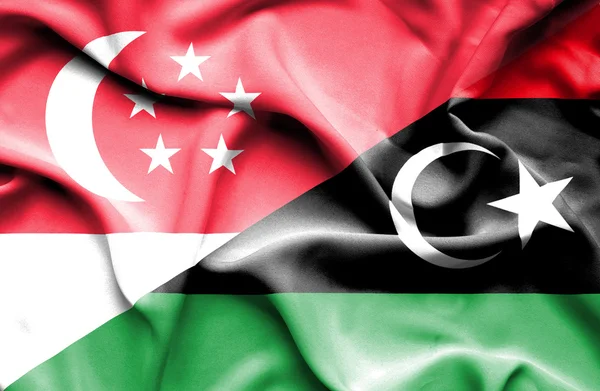 Vlající vlajka Libye a Singapur — Stock fotografie