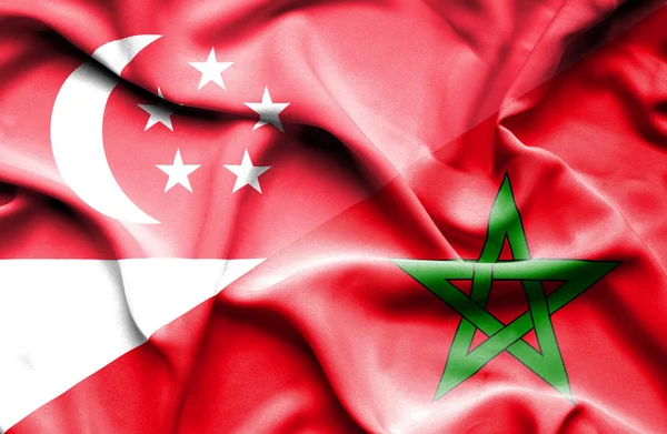 Vlající vlajka Maroka a Singapur — Stock fotografie