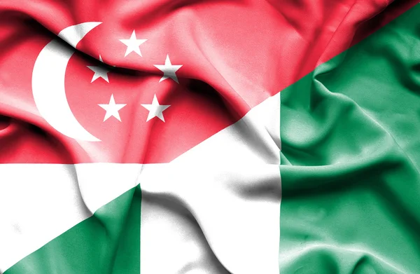 Waving flag of Nigeria and Singapore — Stock Photo, Image