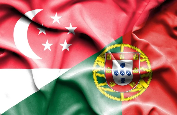 Viftande flagga portugal och, singapore — Stockfoto